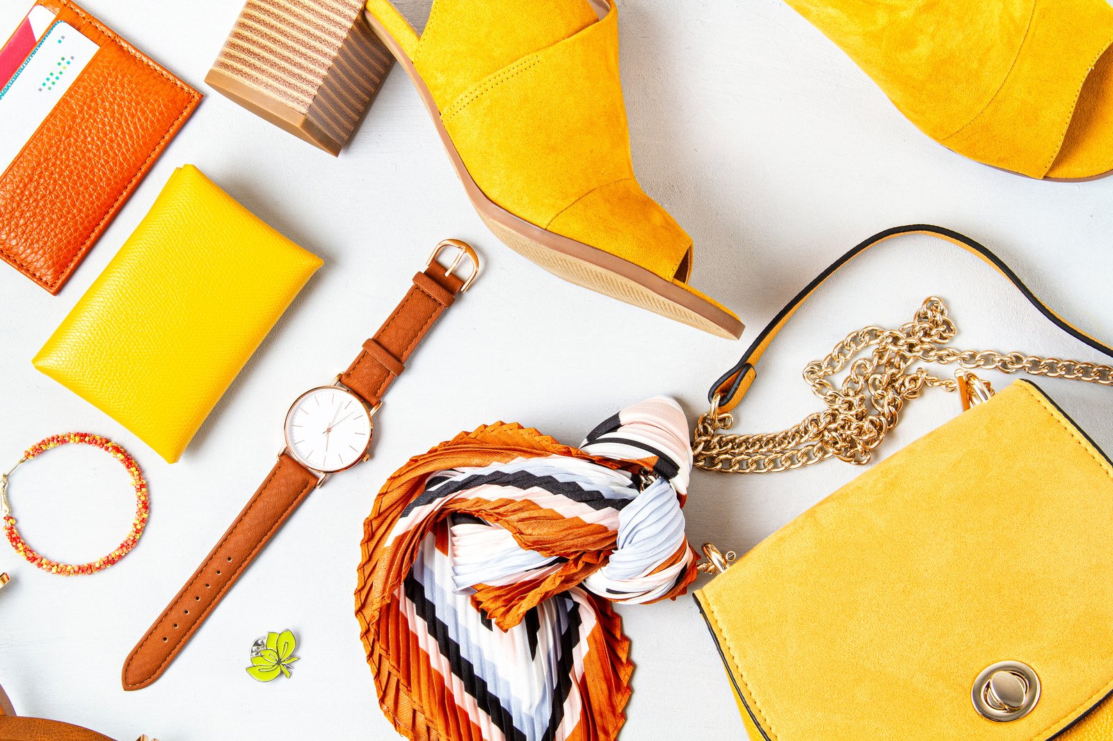 Flat lay with woman fashion accessories in yellow colors. Fashion blog, summer style, shopping and